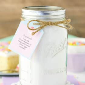 A mason jar with vanilla cake mix in it.
