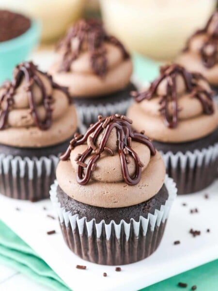 Close up of Baileys chocolate cupcakes on a white tray.