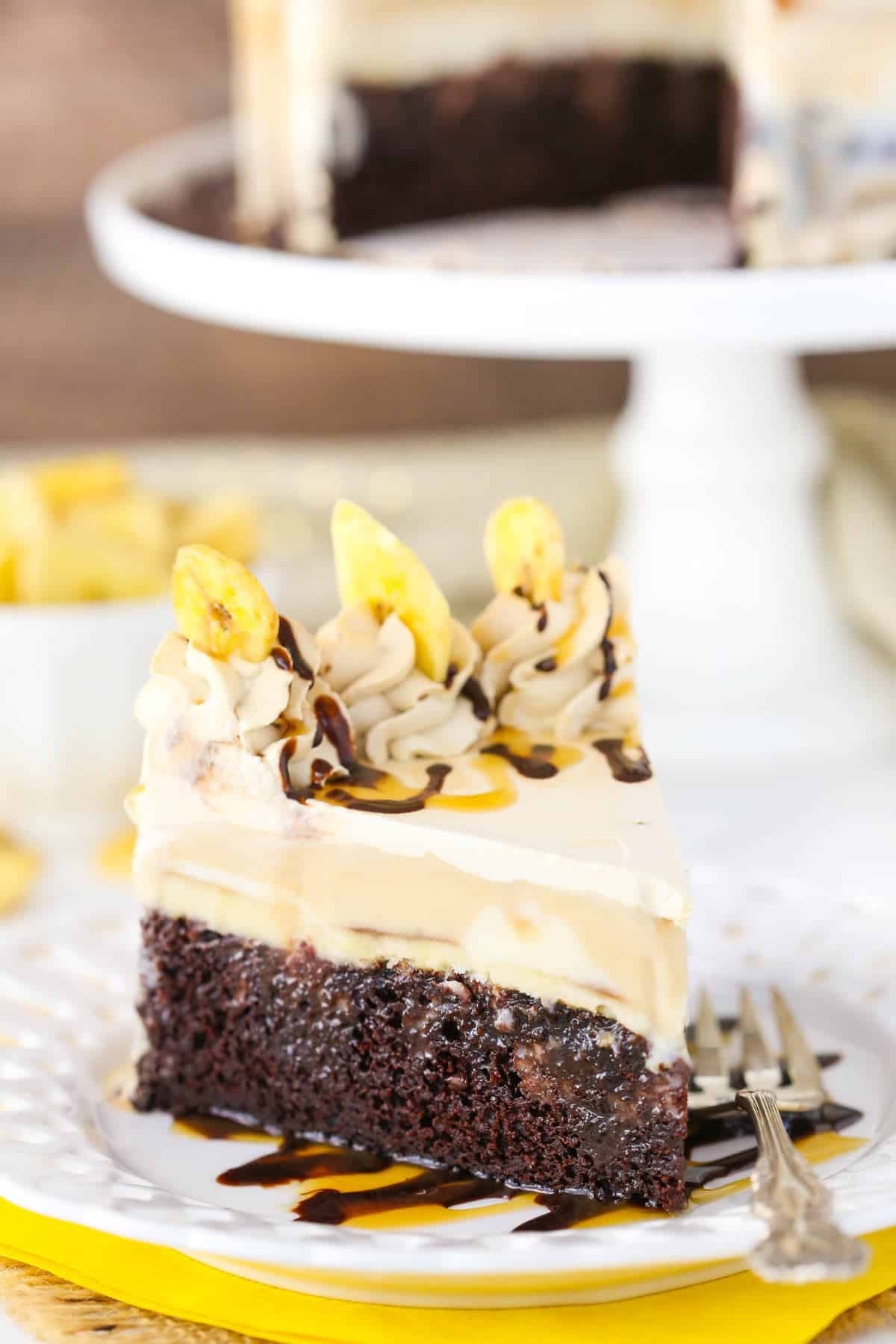 A slice of banana mocha ice cream cake on a white plate.