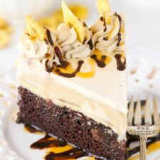 A slice of banana mocha ice cream cake on a white plate.