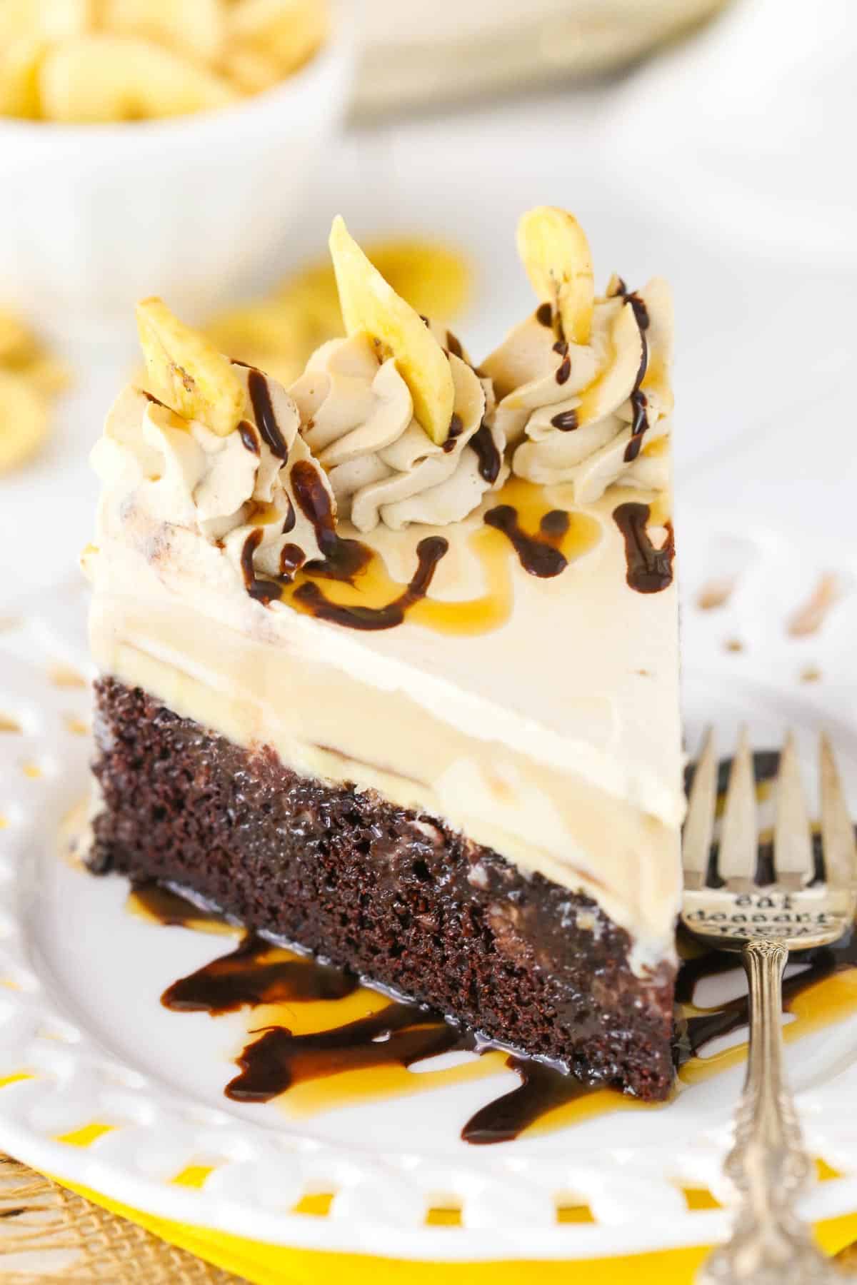 A slice of banana mocha ice cream cake on a white plate.