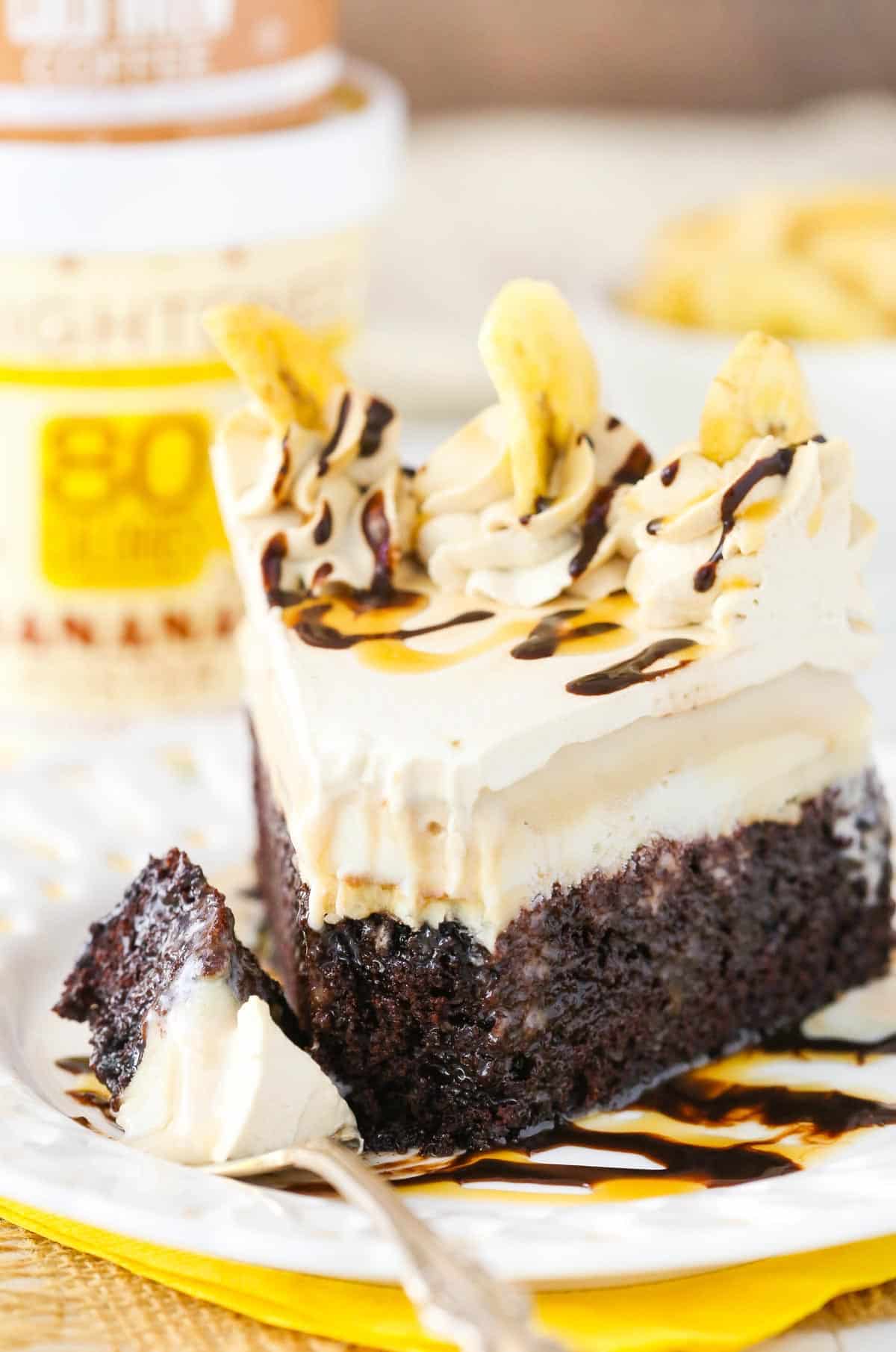 A slice of banana mocha ice cream cake with a bite removed on a fork.