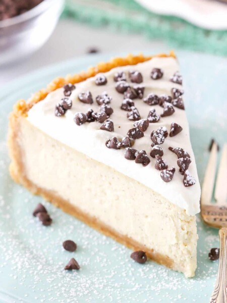 A slice of cannoli cheesecake on a light blue plate.
