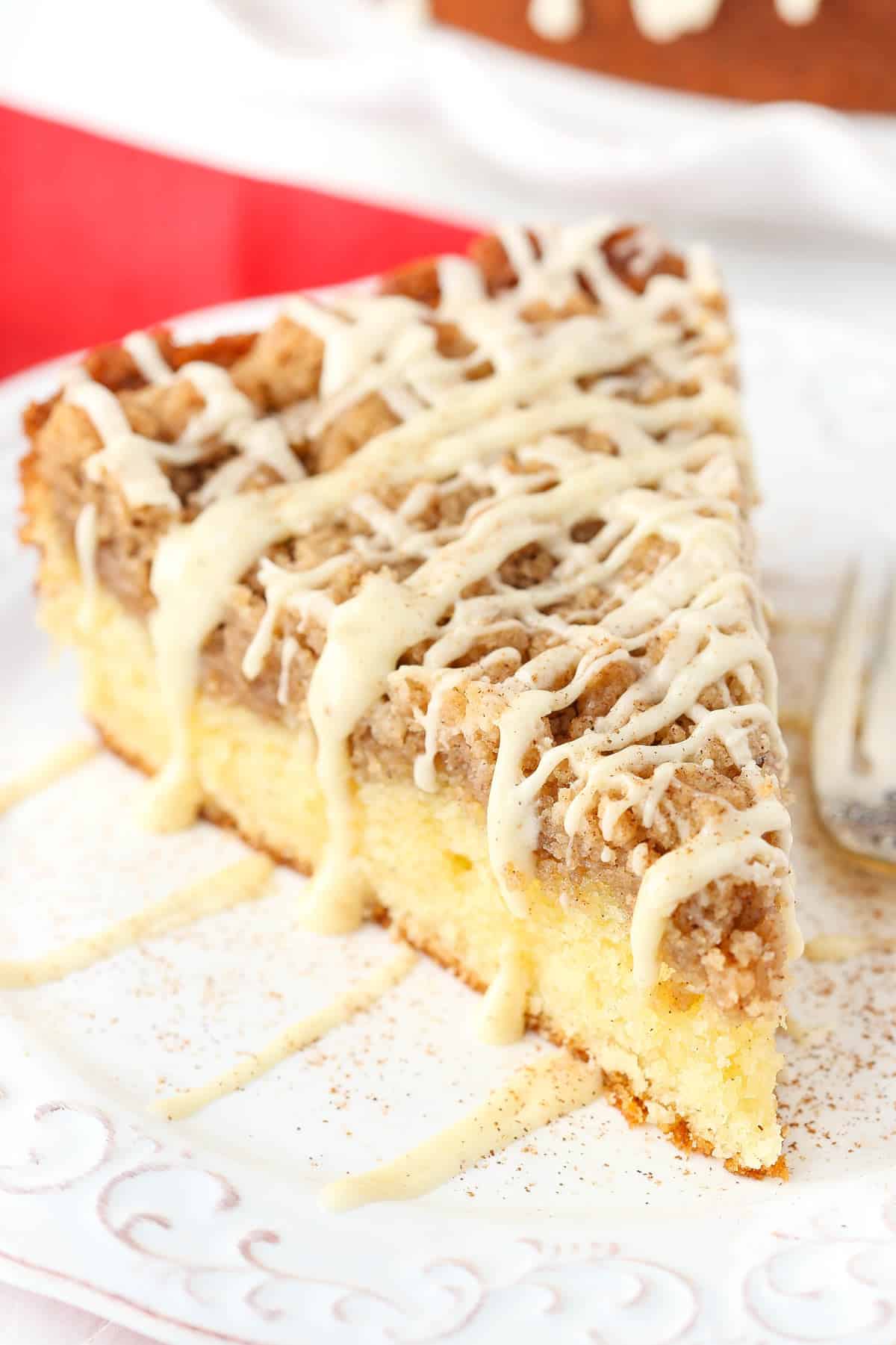 Top view of a slice of eggnog crumb cake with drizzle on top.