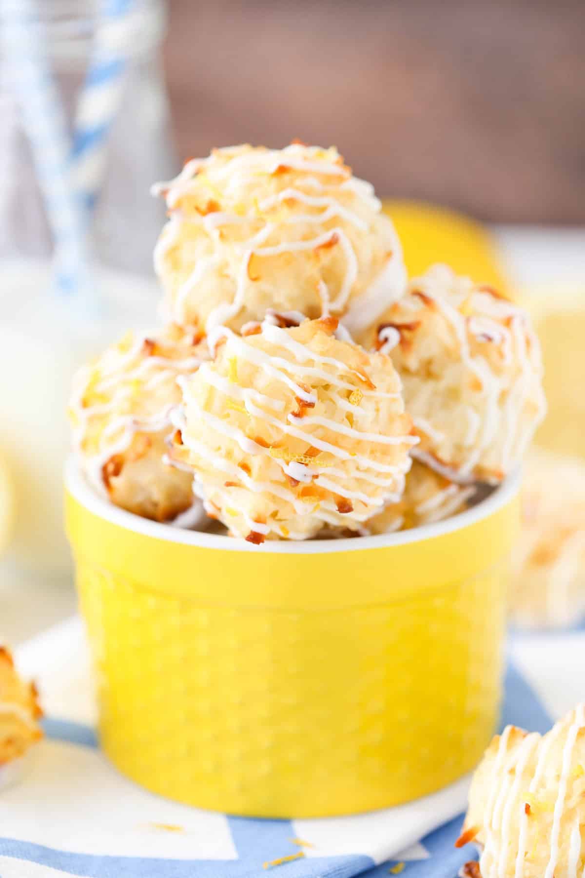 A yellow ceramic container filled with lemon coconut macaroons.