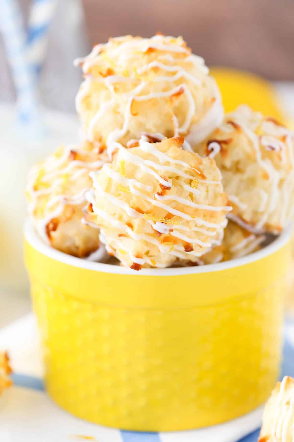 A yellow container filled with lemon coconut macaroons.