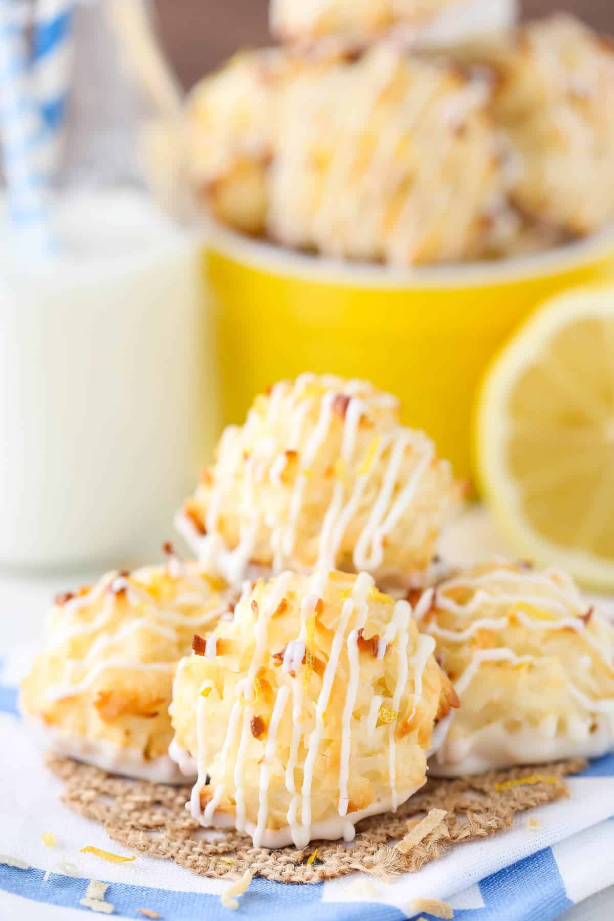 A small pile of lemon coconut macaroons on a blue and white napkin.