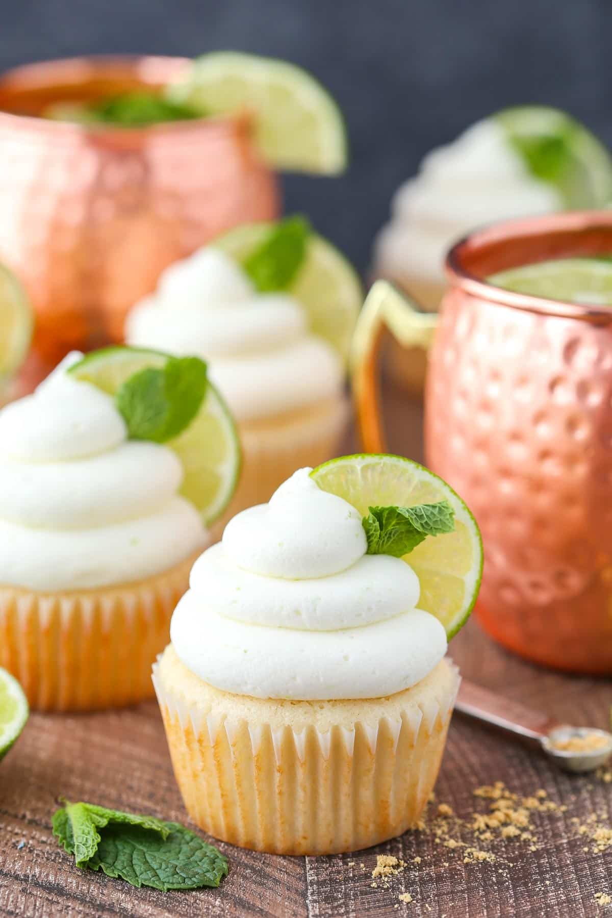 A Moscow mule cupcake with more cupcakes in the background.