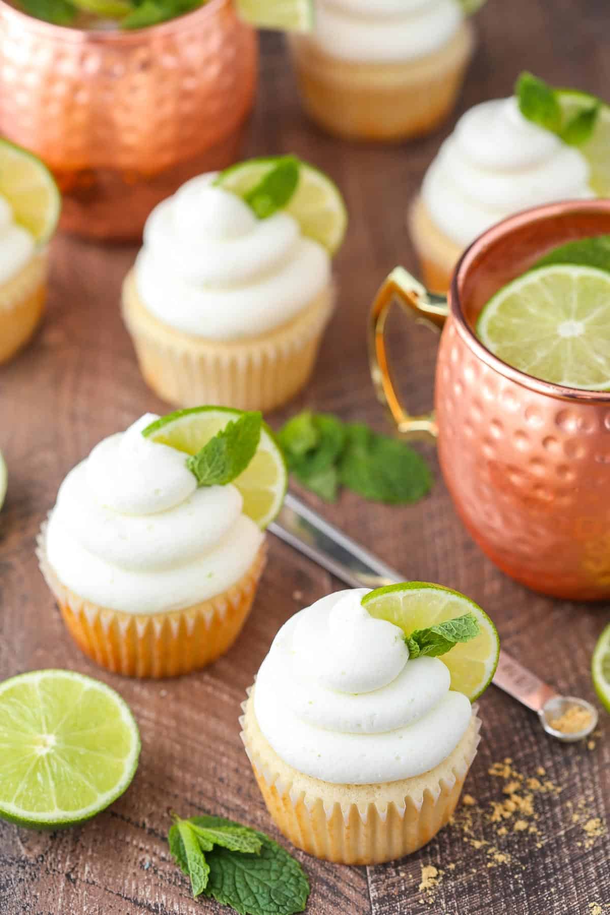 Top view of four Moscow mule cupcakes on a wooden surface.