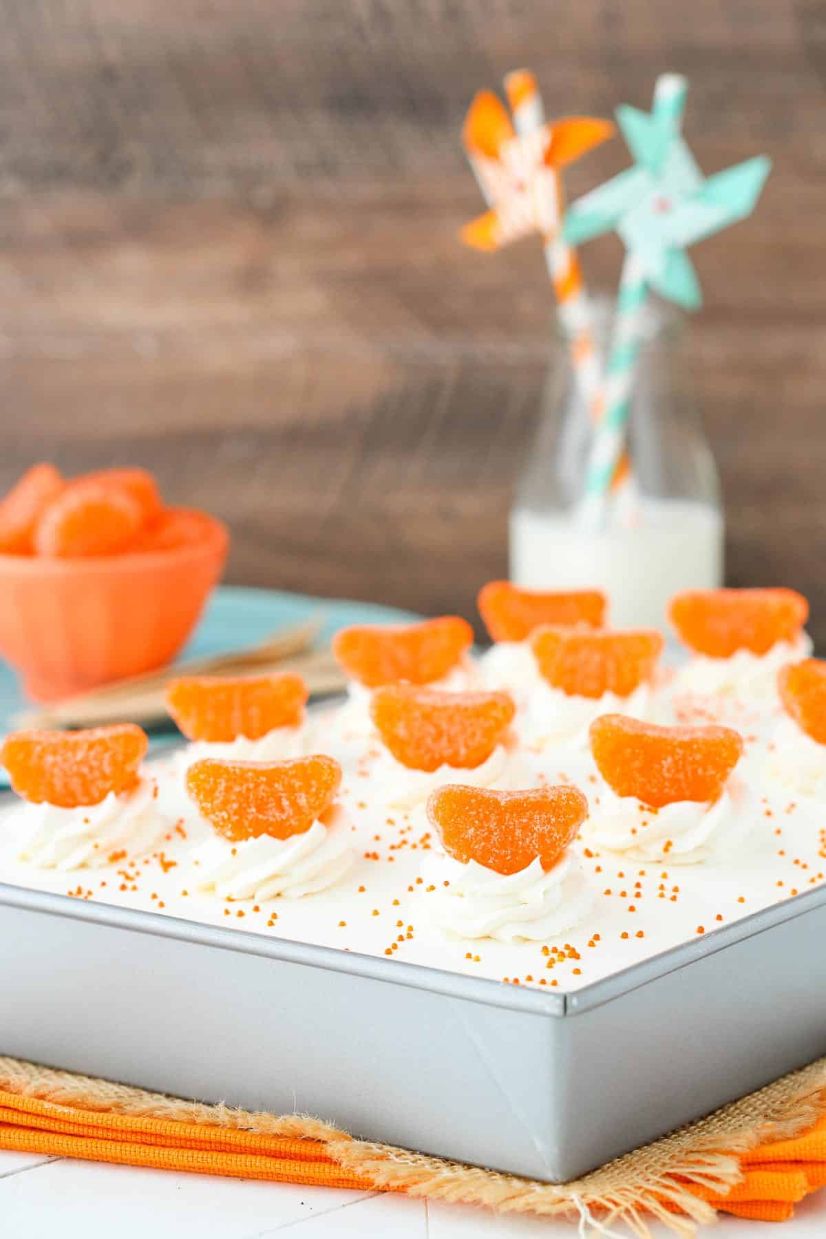 A cake pan filled with orange creamsicle poke cake.