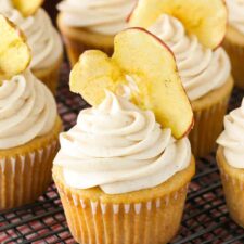 Close up of apple butter cupcakes on a wire rack.
