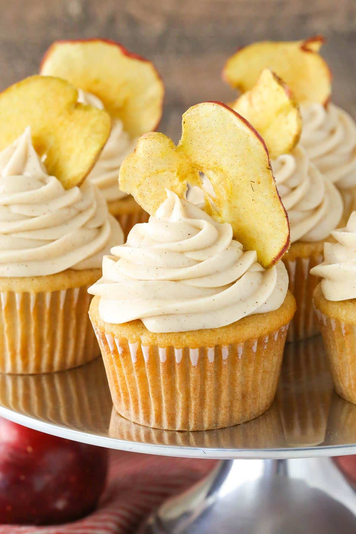 Close up of apple butter cupcakes on a silver cake stand.