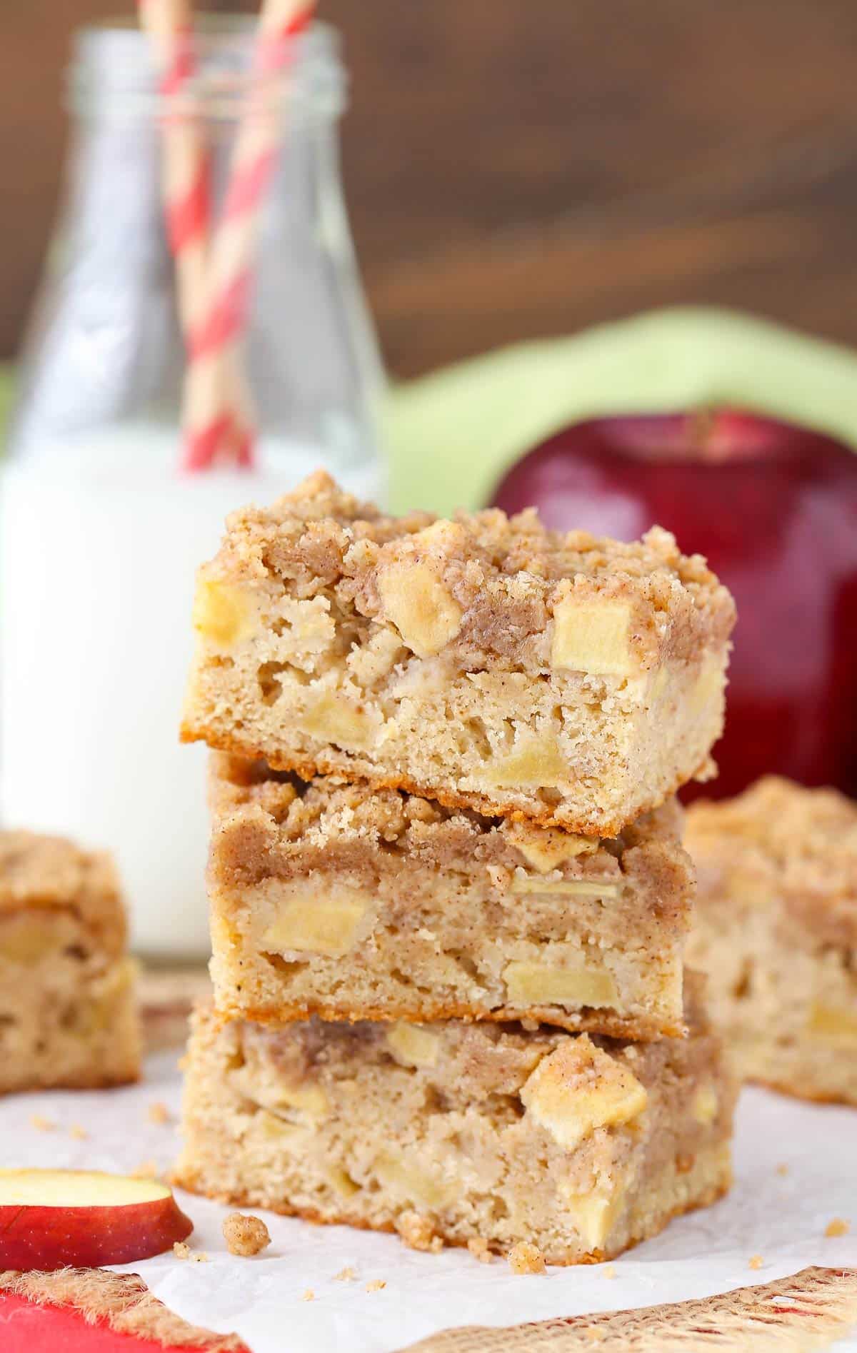 Three apple streusel bars stacked one on top of the other.
