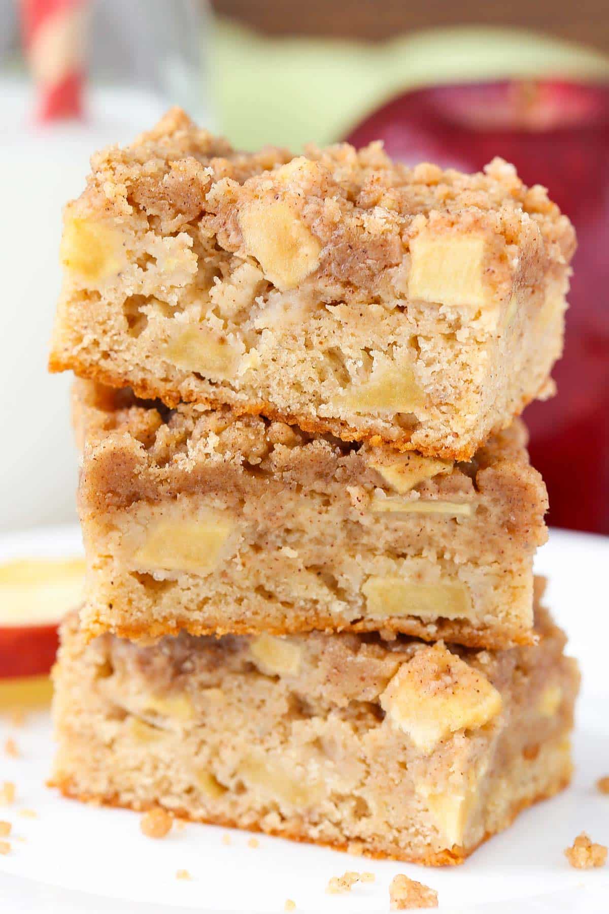 Close up of three apple streusel bars stacked one on top of the other.
