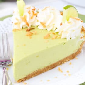 Close up of a slice of avocado key lime pie on a small white plate.