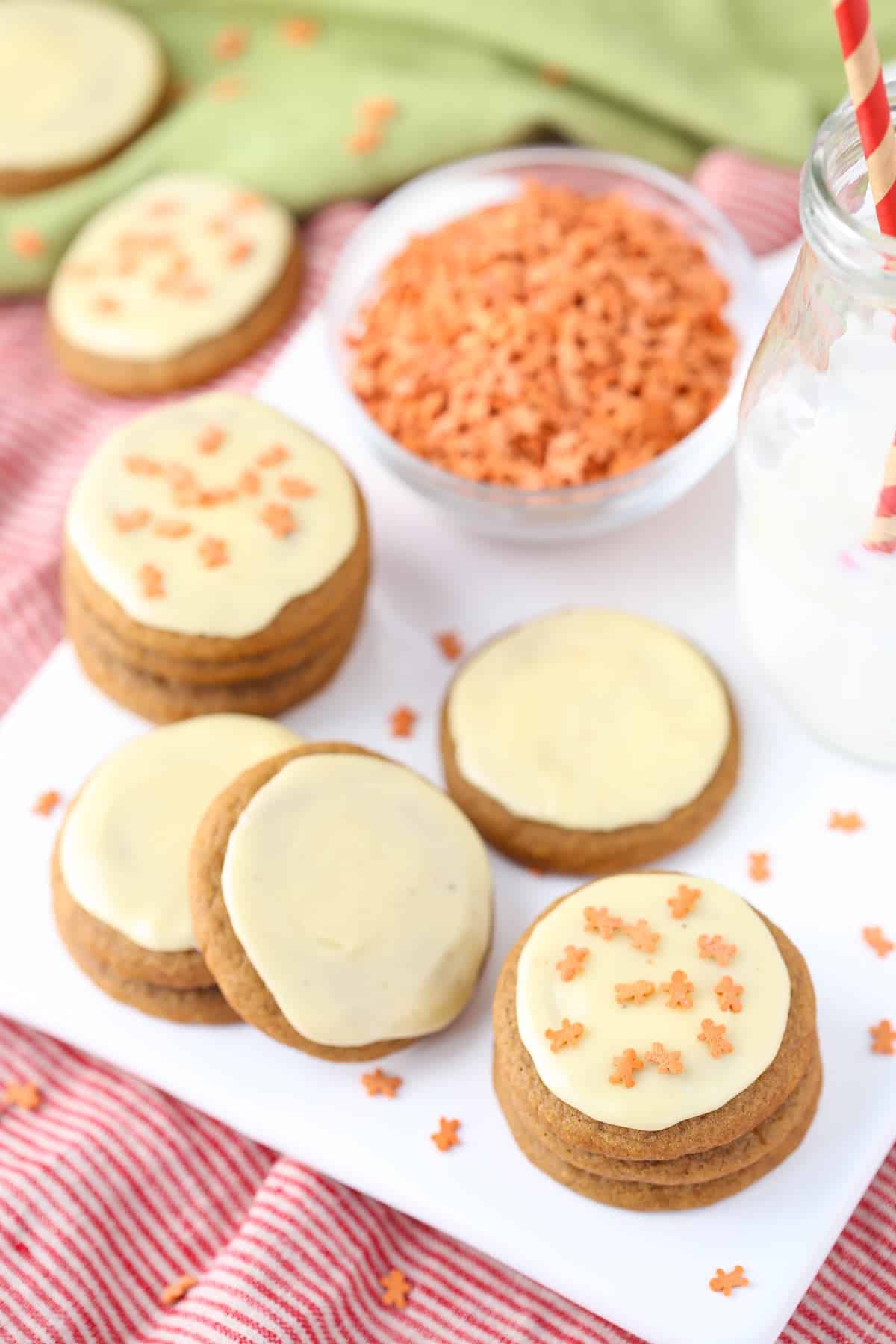 Top view of a few stacks of gingerbread cookies with eggnog icing.