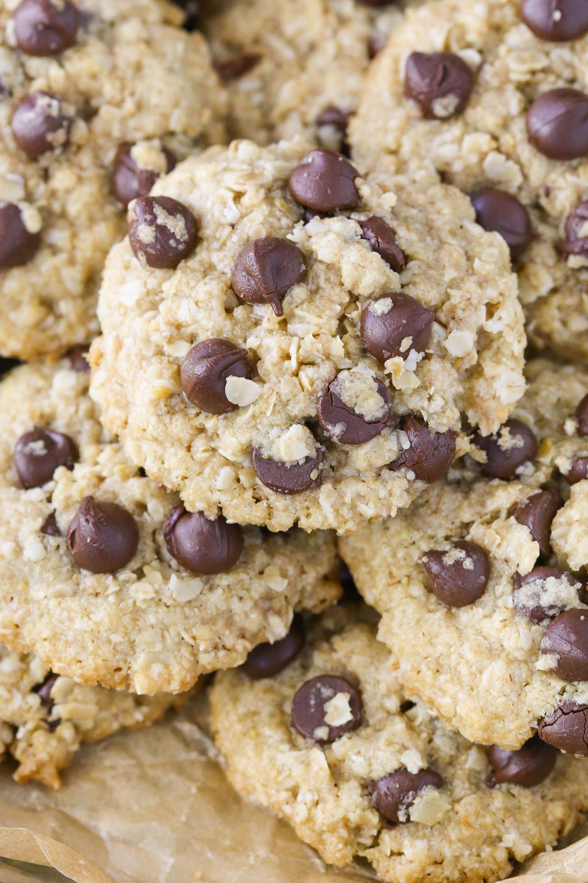 Close up of a pile of gluten and dairy free oatmeal chocolate chip cookies.