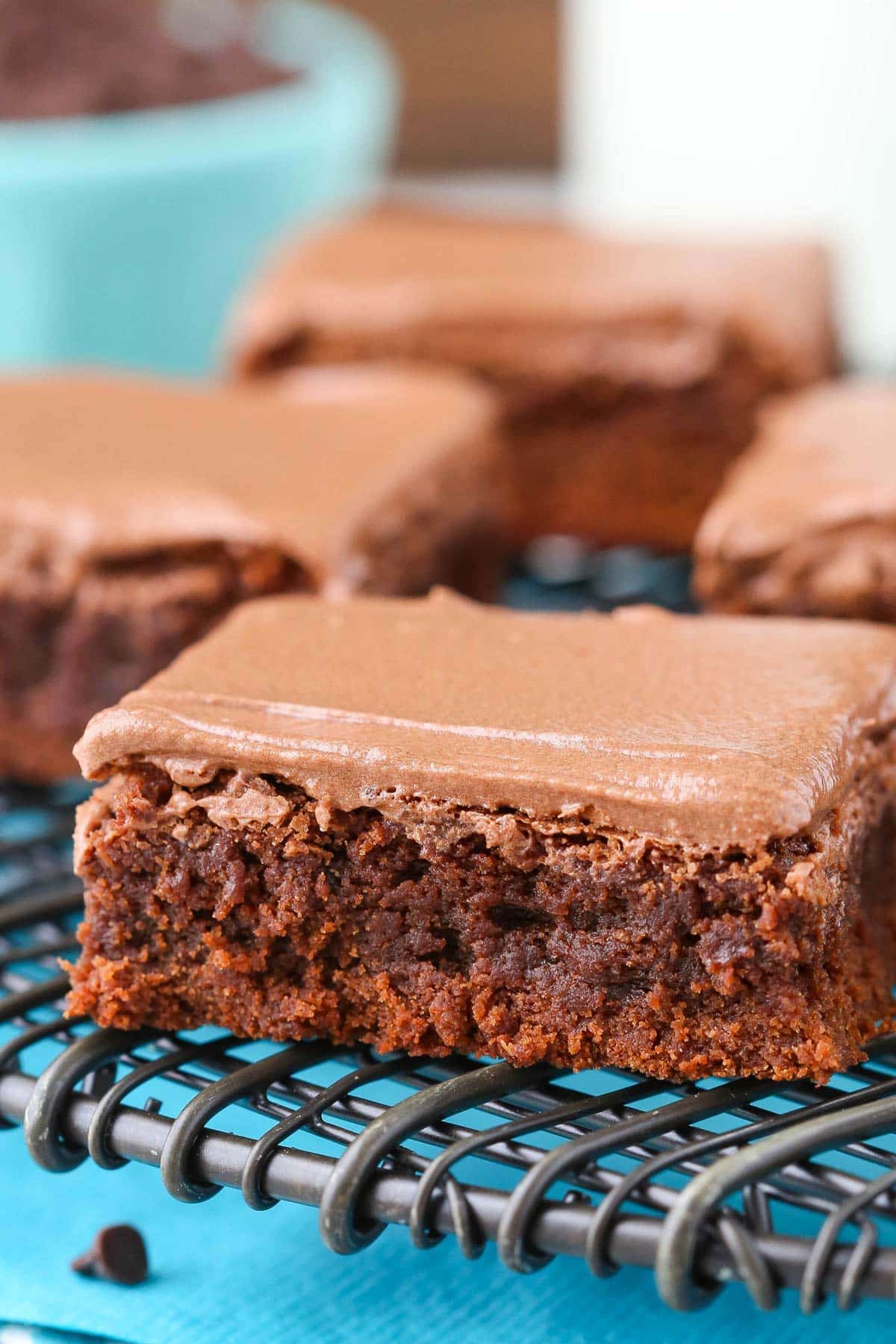 Close up of a fudgy brownie on a wire rack.