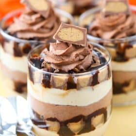 Close up of a mini Reeses chocolate peanut butter cheesecake trifle.