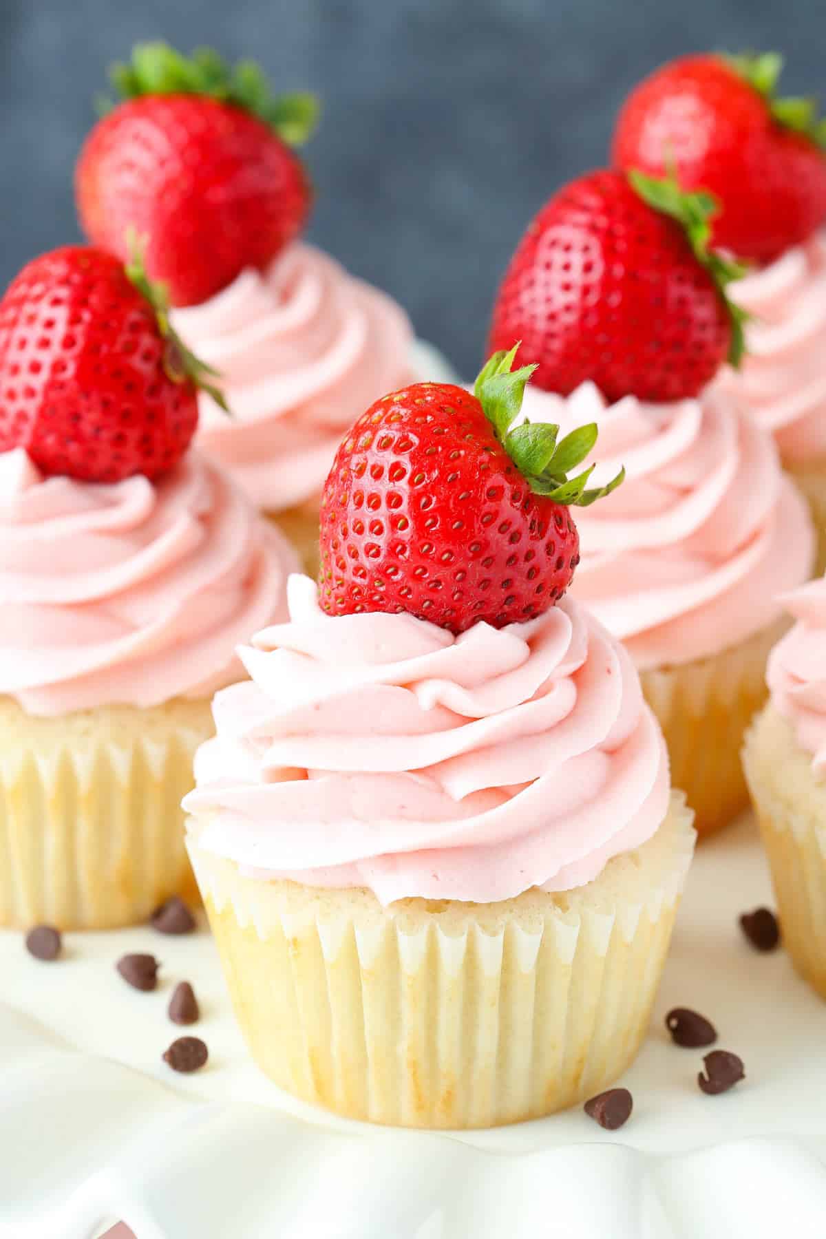 Close up of neapolitan cupcakes on a cake stand.