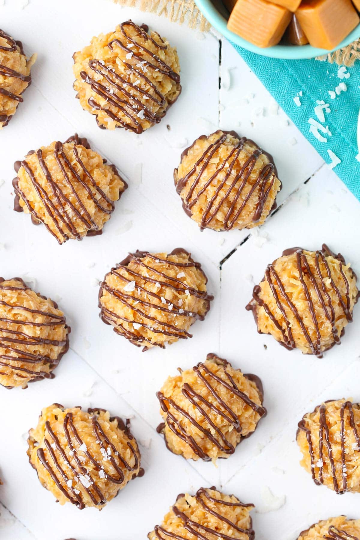 Top view of no bake salted caramel macaroons on a white surface.