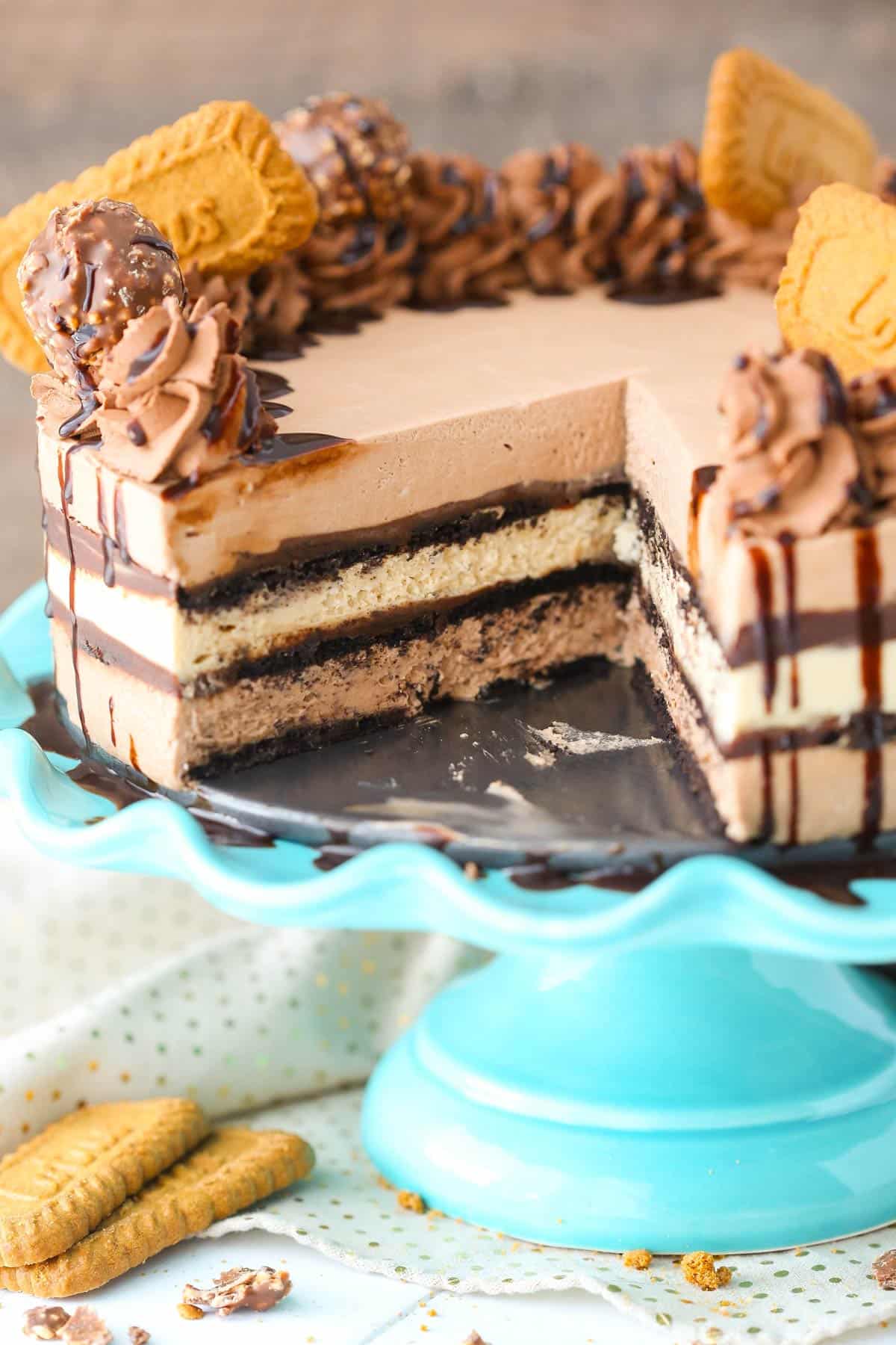 A Nutella Biscoff icebox cake with a slice removed to show the interior layers.
