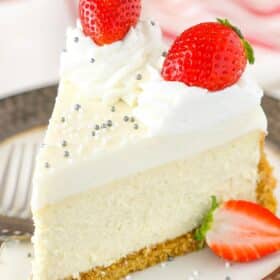 Close up of a vanilla bean cheesecake on a plate.