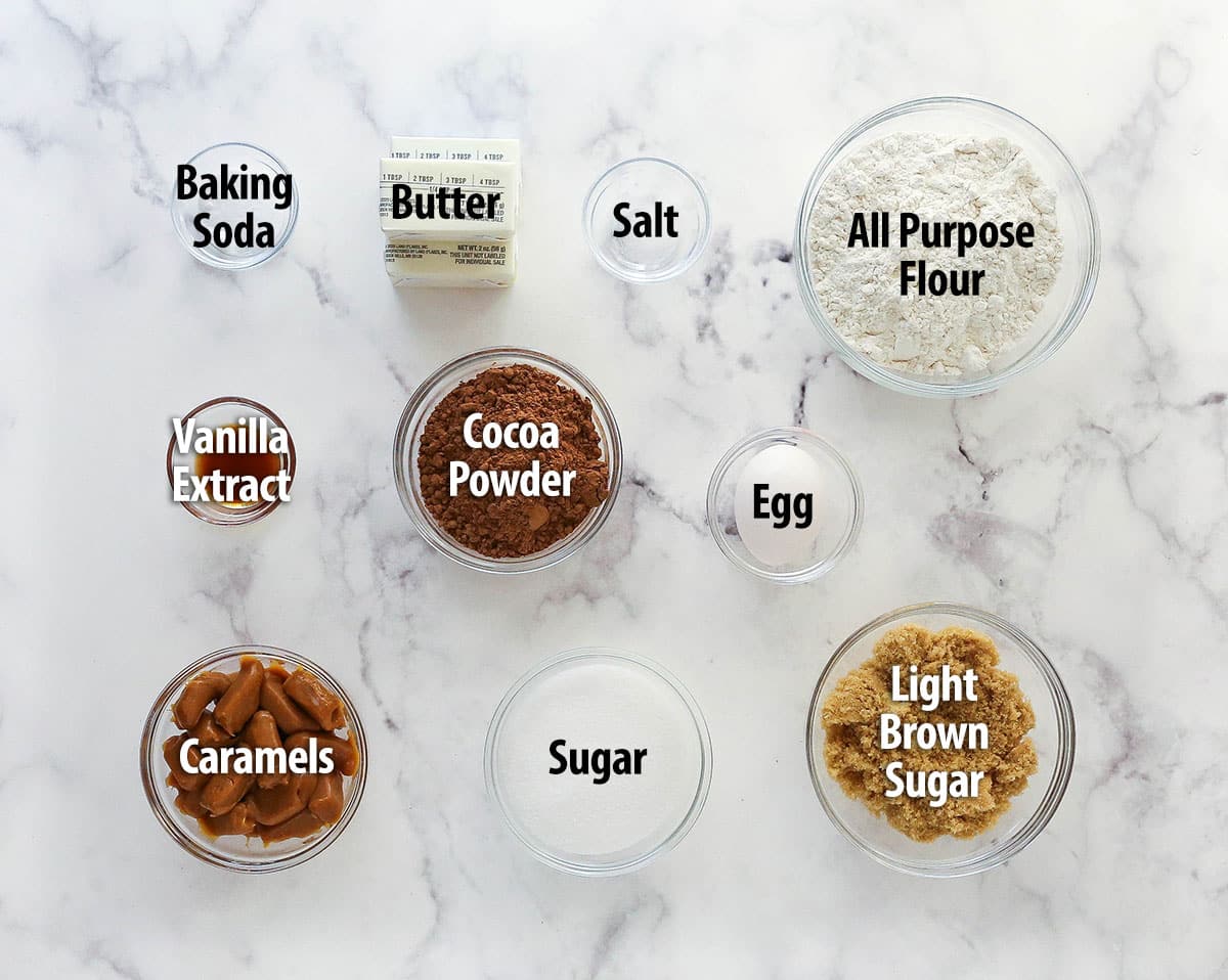 These caramel stuffed cookies feature a soft, chewy chocolate cookie dough that perfectly complements a gooey, sweet caramel center. Labeled ingredients for caramel stuffed cookies.