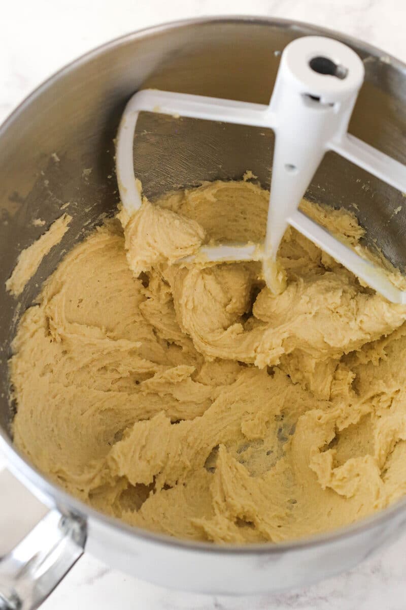 Creaming together butter and sugars for cookie dough.