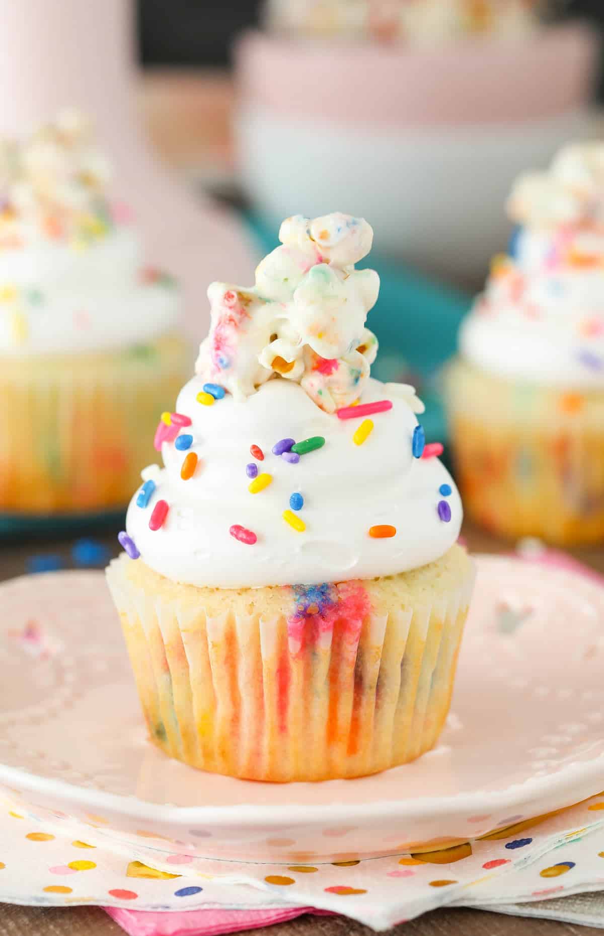 Close up of a funfetti popcorn marshmallow treat cupcake.