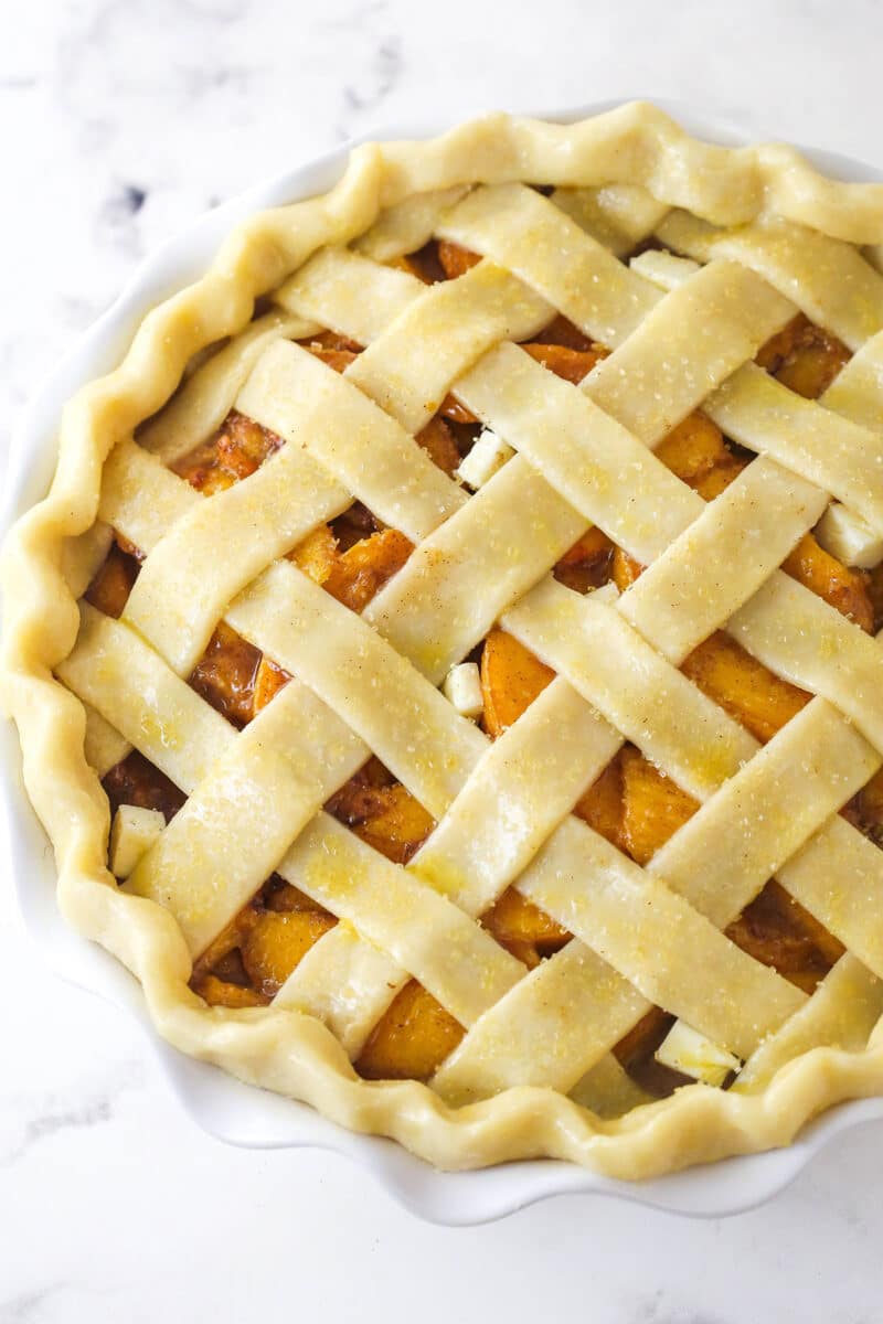 Peach pie ready to go in the oven.