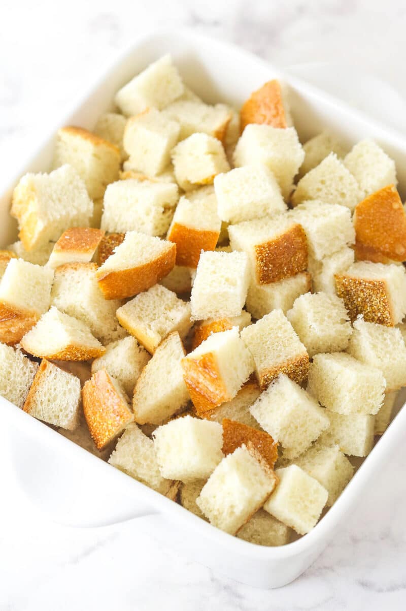 Stale bread cubes in a casserole dish.