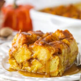 A slice of pumpkin bread pudding on a plate.