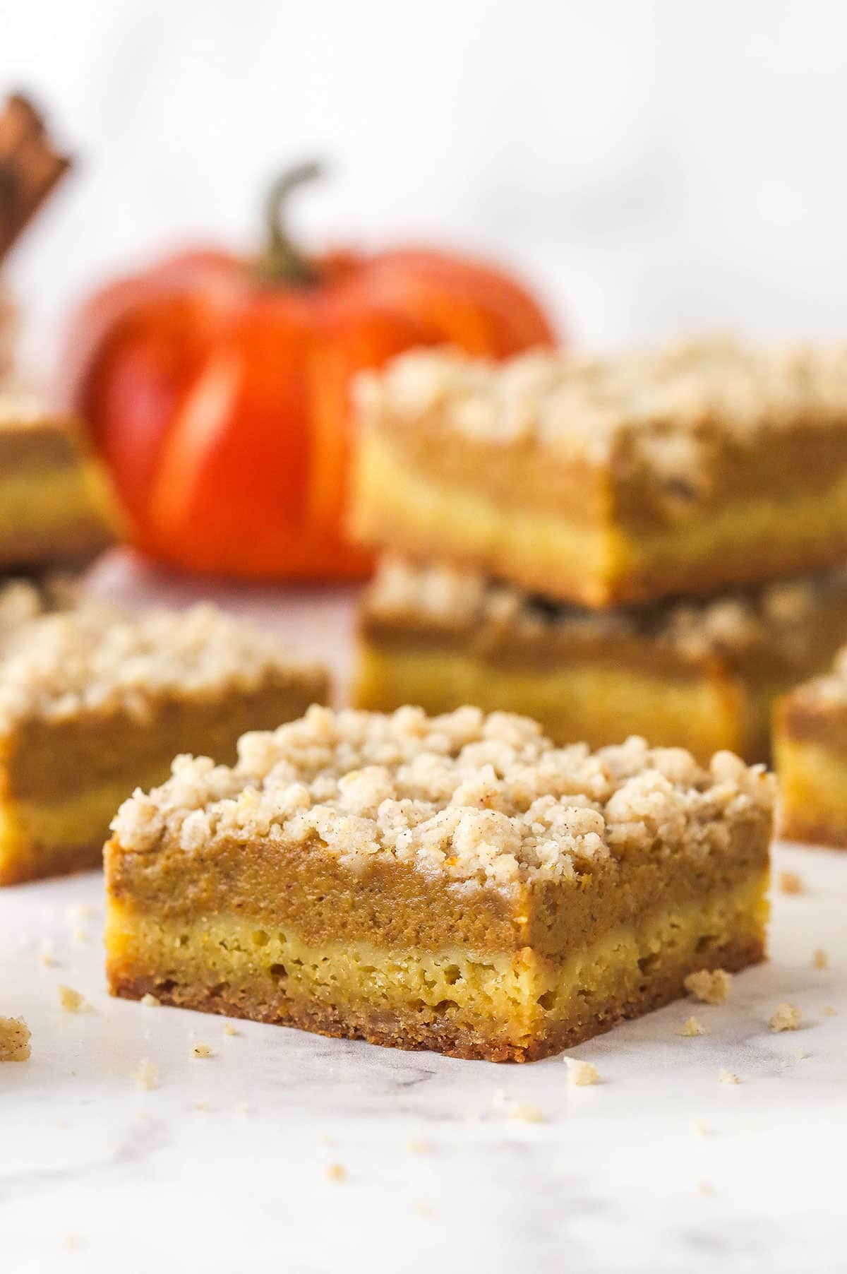A pumpkin pie blondie bar on a marble counter.