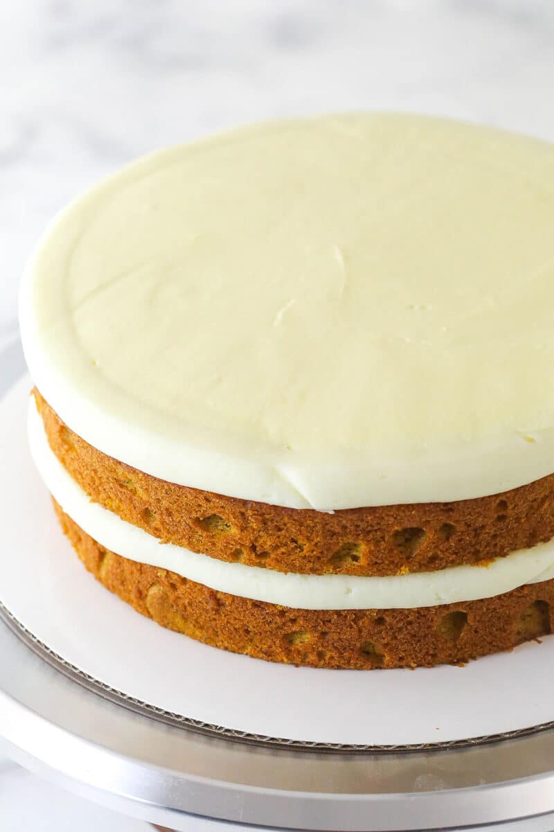 Two layers of pumpkin cake filled and topped with mascarpone filling.