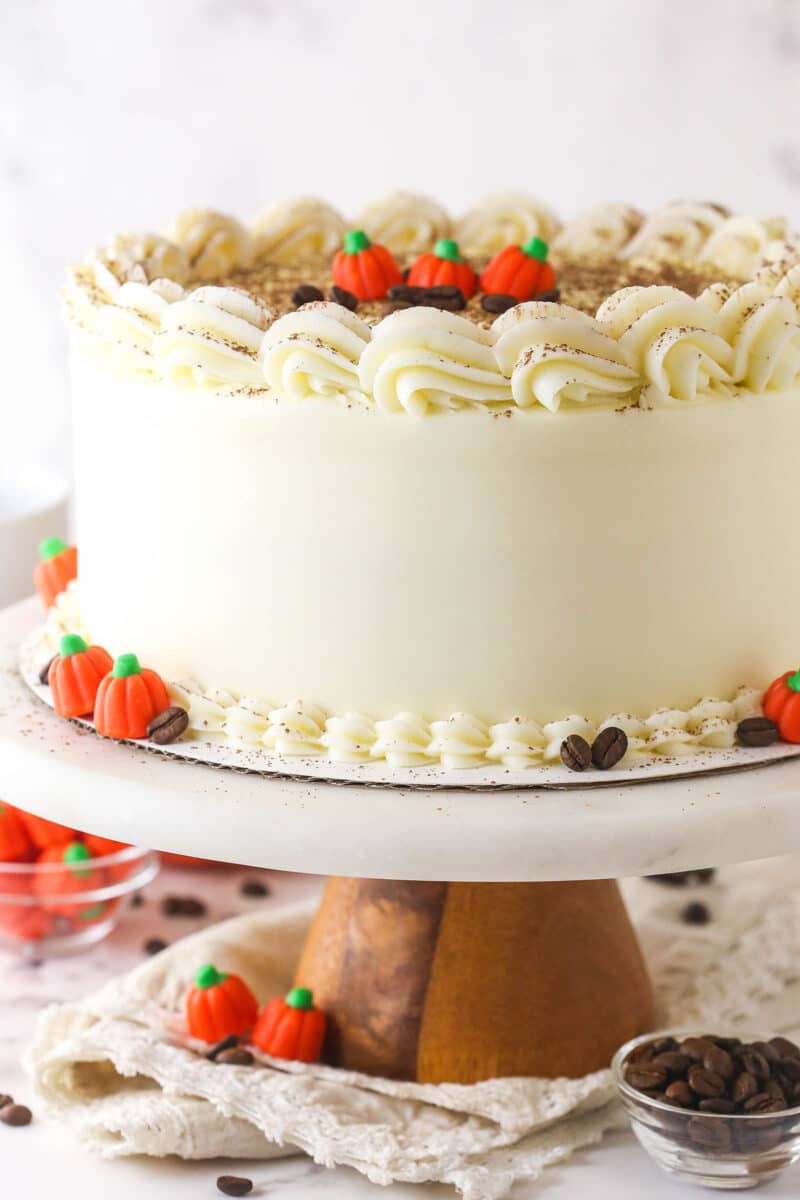 Close-up image of pumpkin tiramisu cake on a cake stand.