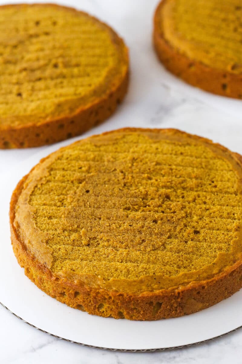 3 layers of pumpkin cake cooling.