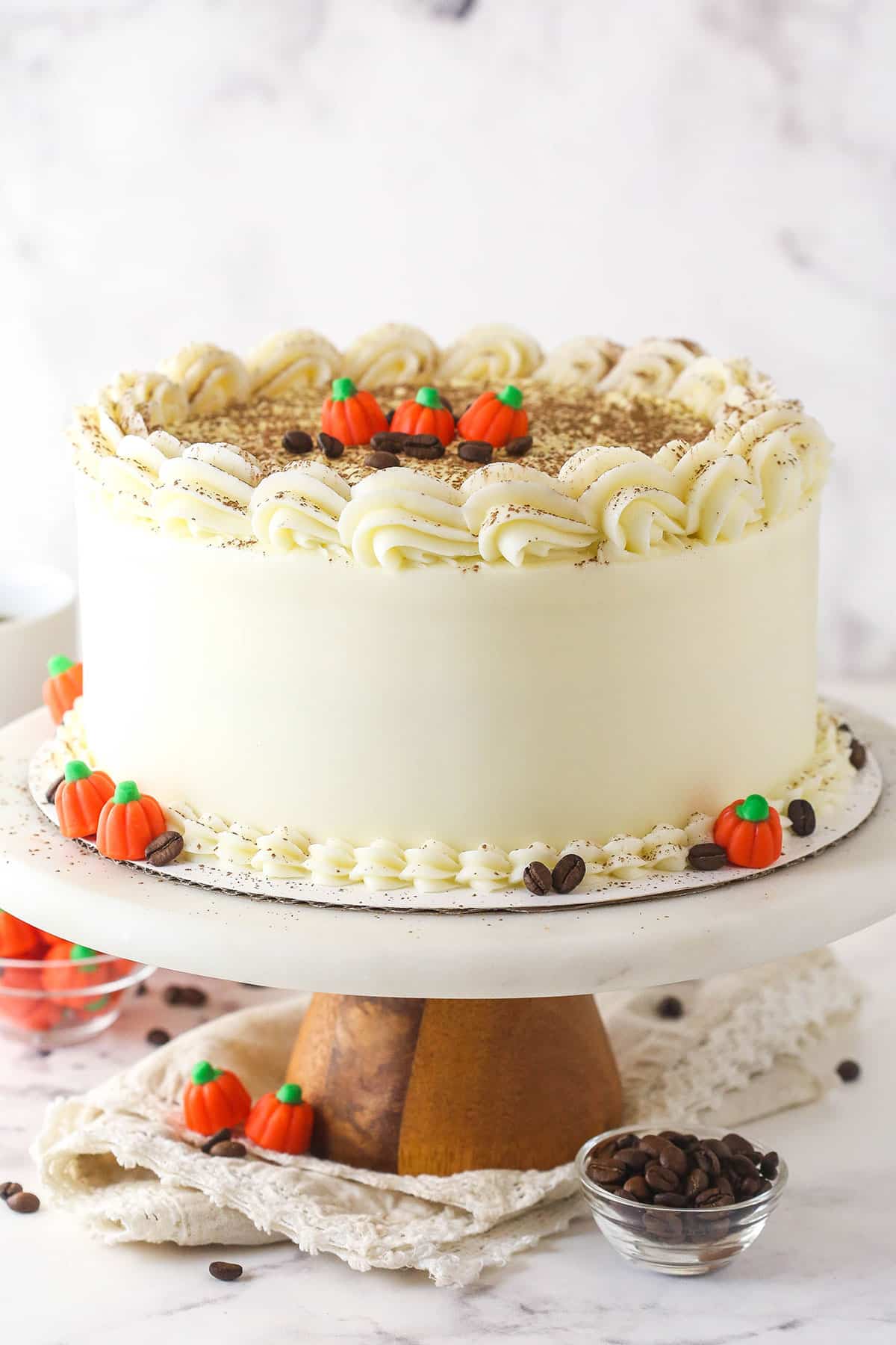 Pumpkin tiramisu layer cake on a cake stand.