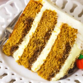A slice of pumpkin tiramisu layer cake on a plate.