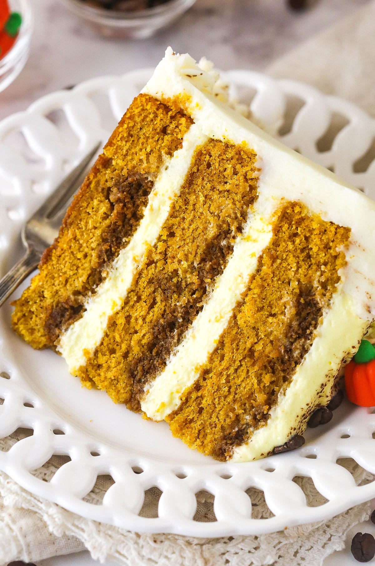 A slice of pumpkin tiramisu layer cake on a plate.