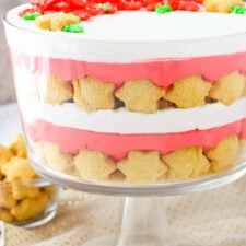 Side view of a red velvet shortbread trifle in a trifle bowl.