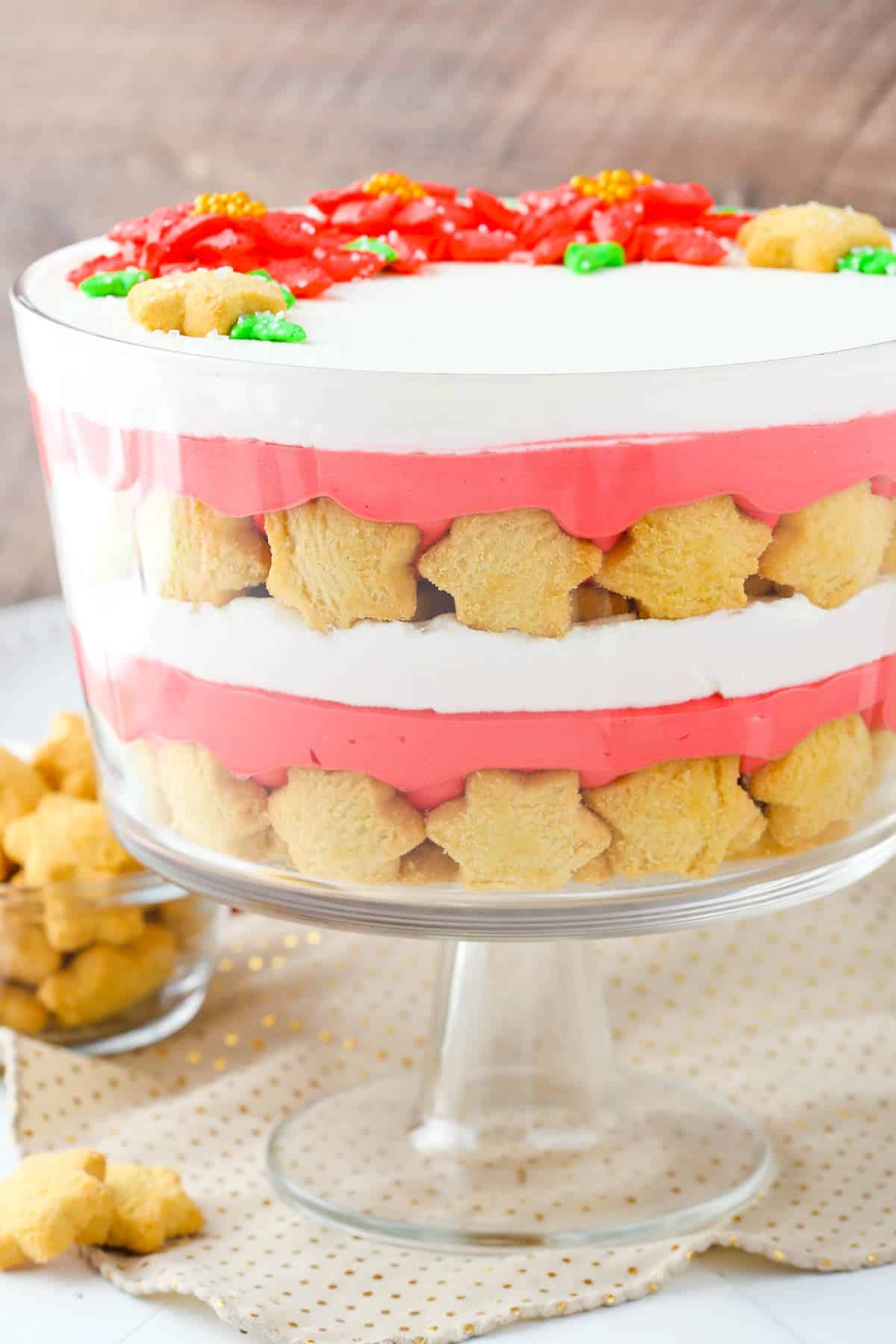 Side view of a red velvet shortbread trifle in a trifle bowl.