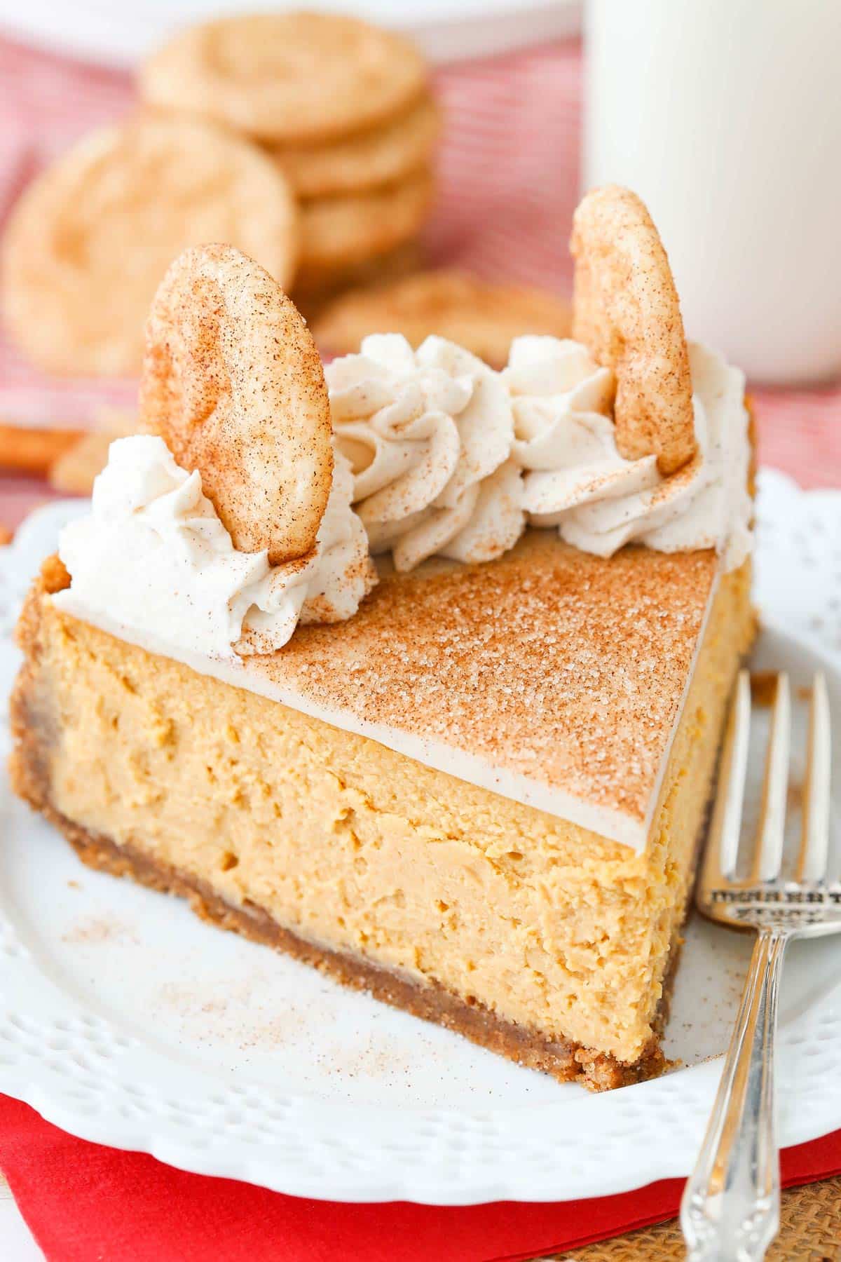 Close up of a slice of snickerdoodle dulce de leche cheesecake.