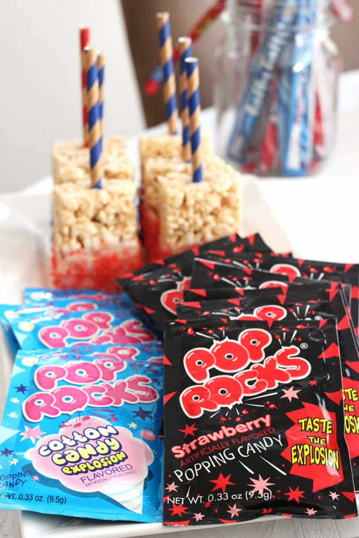 Pop Rocks candy in front of a tray of American flag rice krispie treats.