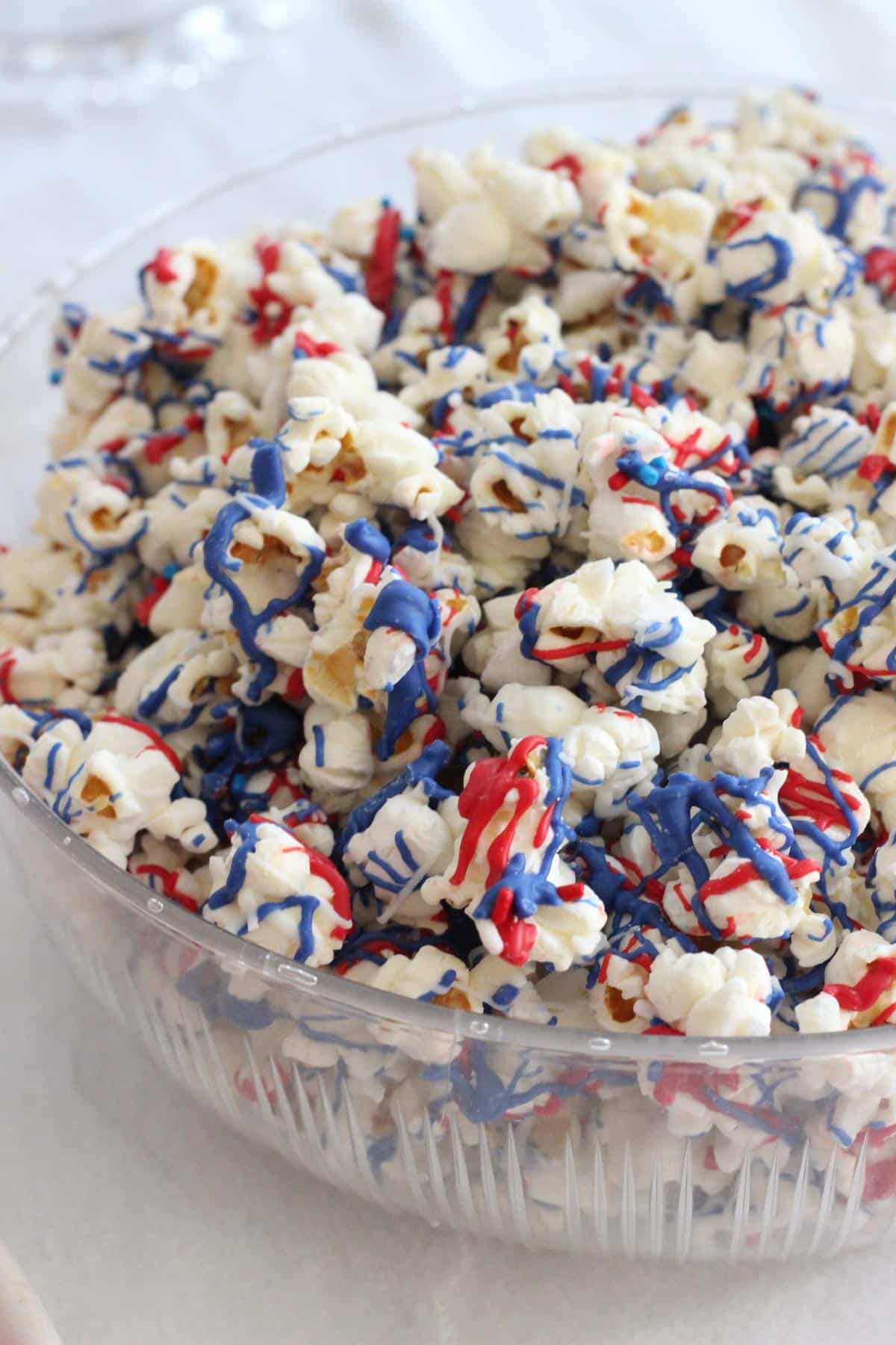 A bowl or red, white, and blue popcorn.