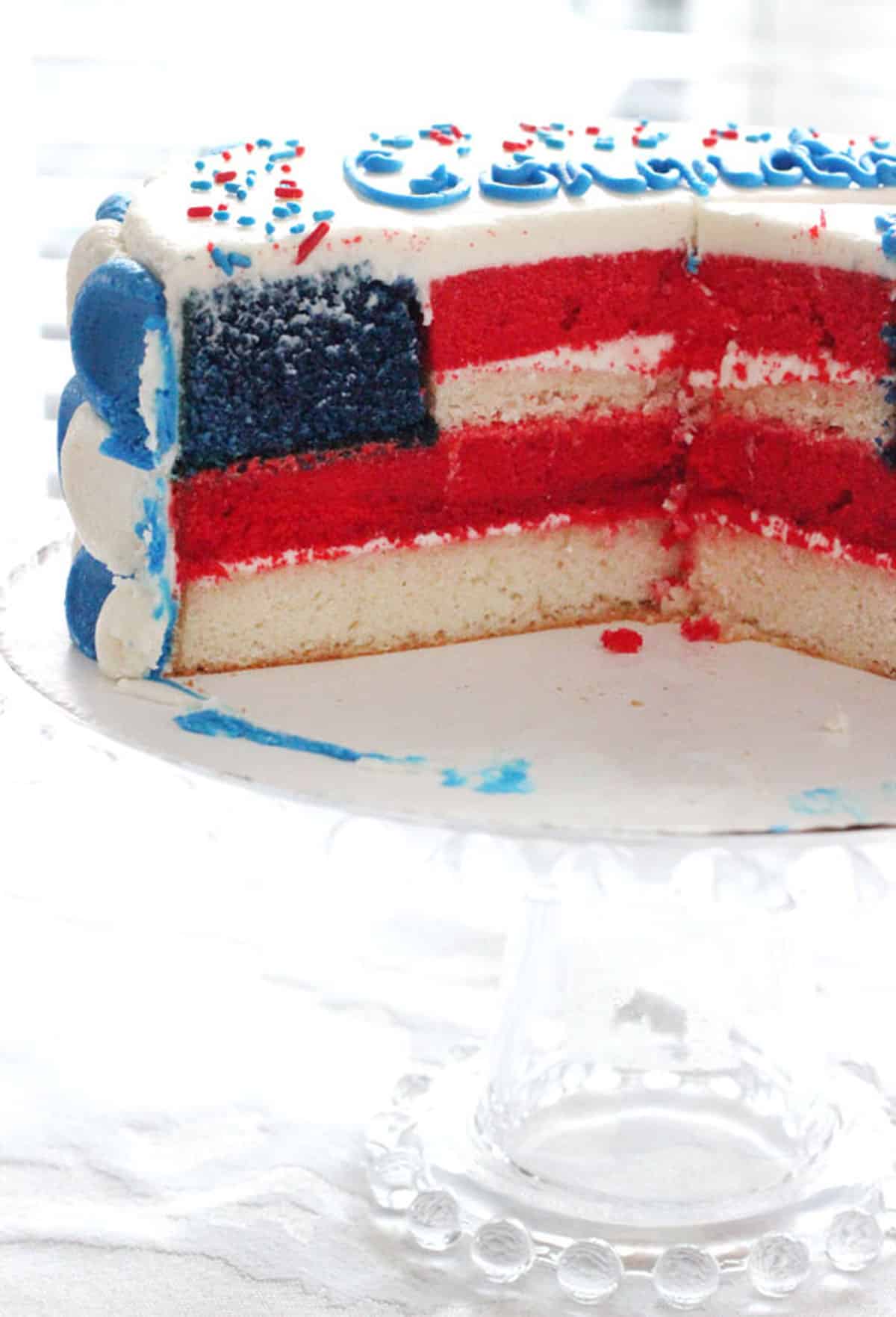 Close up of an American Flag Cake that's cut open to show layers.