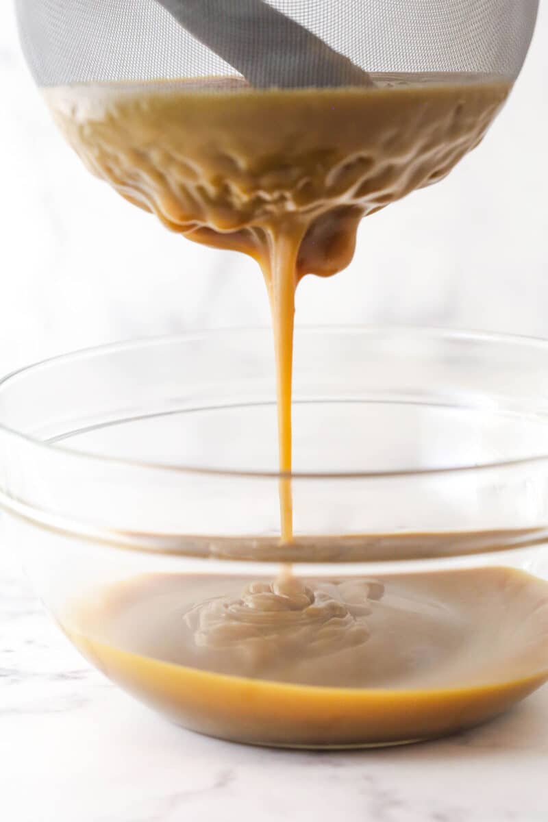 Straining the filling for butterscotch pie.
