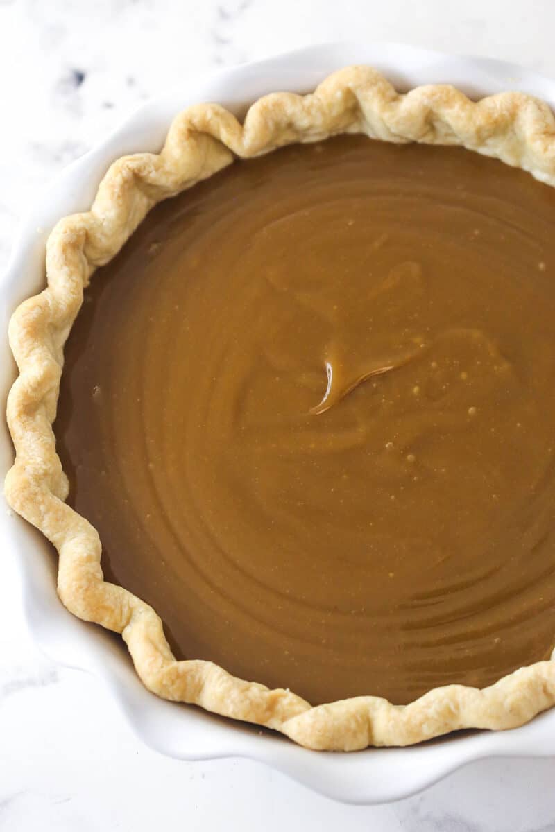 A blind-baked pie crust filled with butterscotch filling.