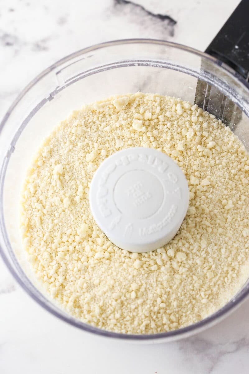 Pulsing additional flour into the beginnings of pie dough.