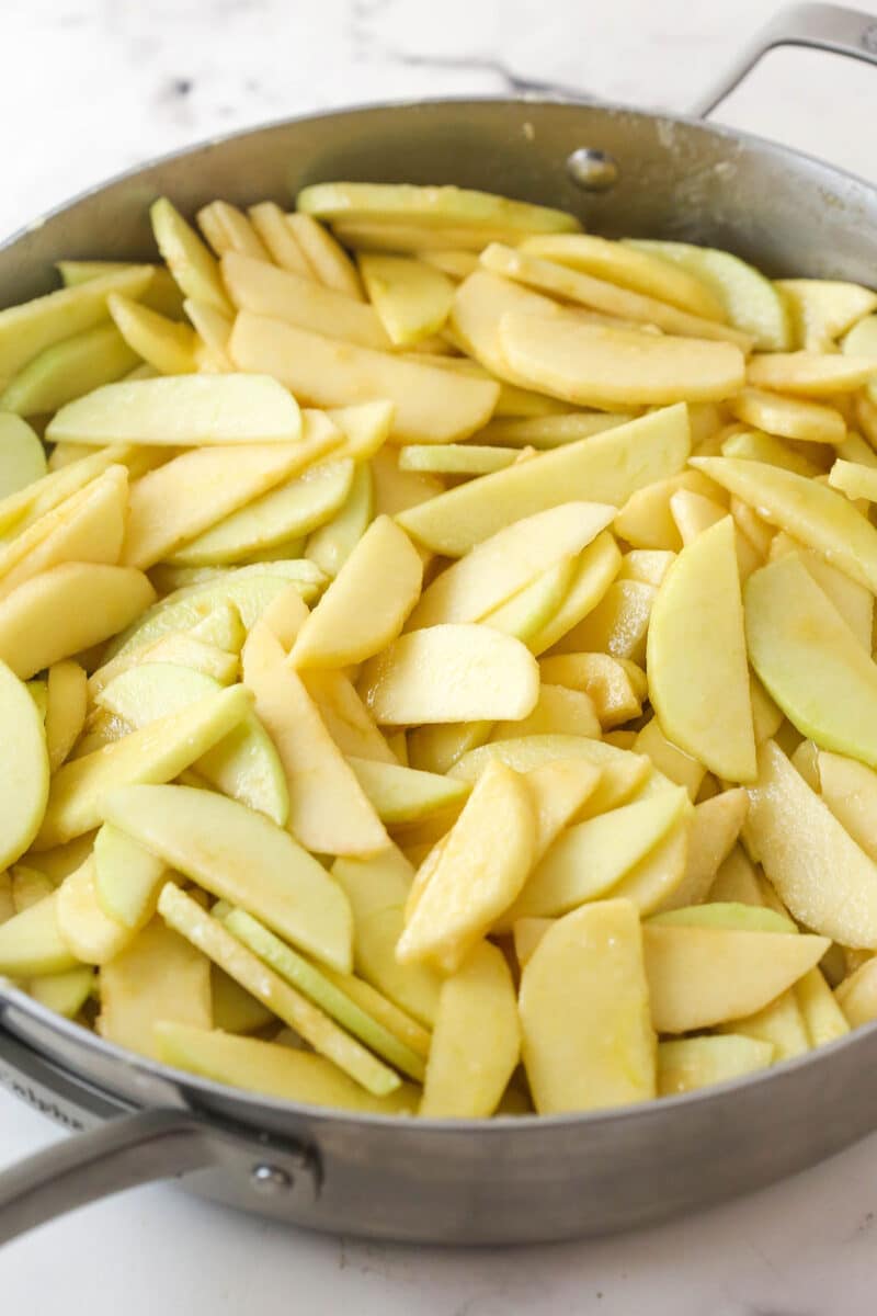 Apples (tossed with sugar, flour, and salt) in a large pan.